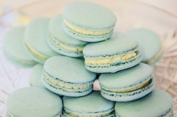 Beautiful blue macarons on glass plate