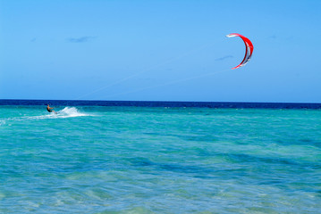 Man practicing kitesurf on Mayotte island, France © fotoember
