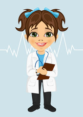 cute little girl wearing laboratory coat writing notes