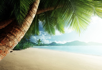 sunset on beach Anse Takamaka, Mahe island, Seychelles