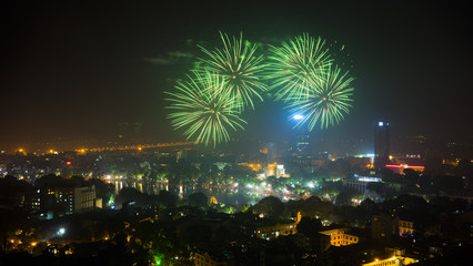 Fototapeta premium Firework on Hanoi liberation 60th day at Hoan Kiem lake, Hanoi, Vietnam