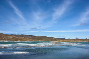 Landscape with salt lake and cirrus clouds