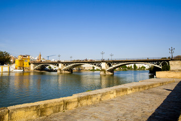 Fototapeta na wymiar guadalquivir and Triana bridge in Seville, Spain