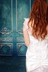 back of bride with blue wood wall