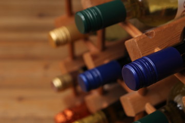 Close up of blue screw top wine bottle with other bottles in a w