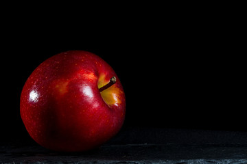 Apple with black balckground and brightness