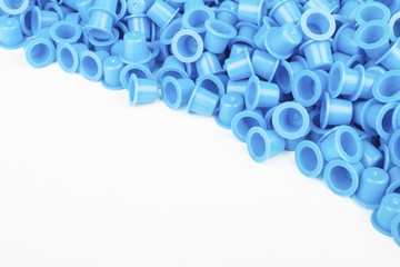 Blue caps for tattoo ink. Macro shot.