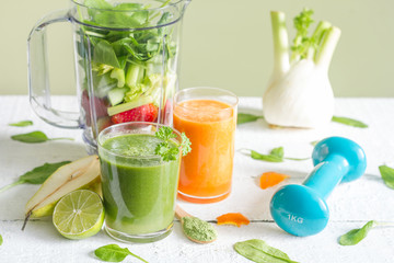 Green smoothie with blender and fruits health diet lifestyle concept
