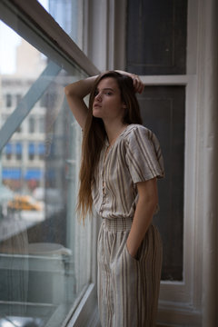 Creative millennial businesswoman thinks about her deadline