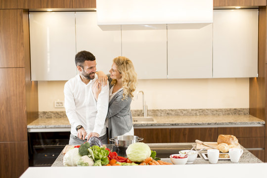 Loving couple in the modern kitchen
