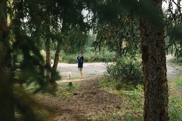 Boy and dog by roadside, National Park, Alaska, North America 