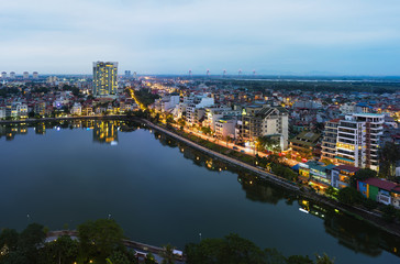 Fototapeta premium Aerial view of Hanoi skyline at West Lake ( Ho Tay in Vietnamese), at twilight