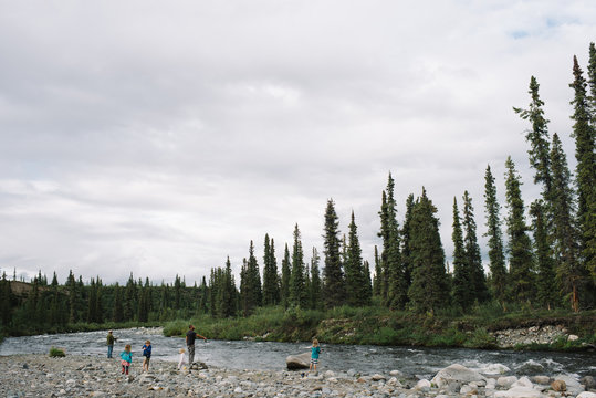 Family at lakeside, National Park, Alaska, North America 
