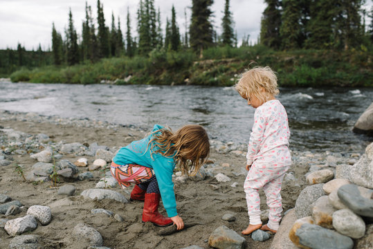 Young sisters exploring by lakeside, National Park, Alaska, North America 