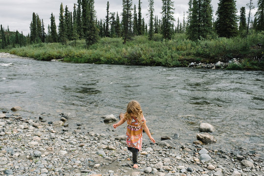 Young girl exploring lakeside, National Park, Alaska, North America 