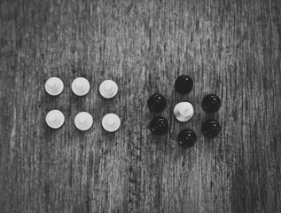 white king surrounded by black pawns