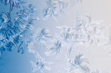 Fototapeta na wymiar Frosty winter background photo of ice buildup on a window