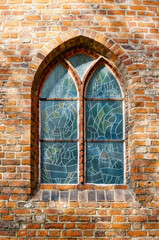 Window with stained glass windows in a medieval building