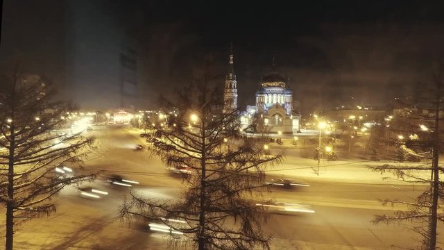 morning car traffic in the Russian city on the background of the Orthodox Church. timelapse