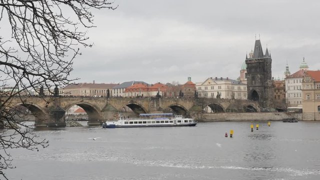 Famous Czech Republic city of Prague on cloudy day 3840X2160 UHD footage - Ancient archtecture of Charles bridge over Vltava river in capital of Czechia slow tilt 2160p UltraHD tilting video