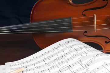 Fototapeta premium Music notes and violin close up