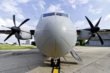 Naklejka na ściany i meble Front of a big military transport aircraft