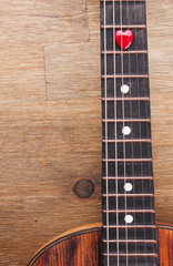 Obraz premium Valentines Day background with hearts on vintage guitar