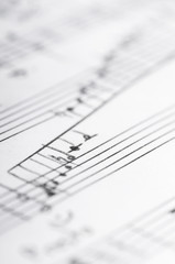 Handwritten musical notes, shallow DOF