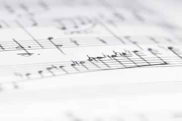 Handwritten musical notes, shallow DOF