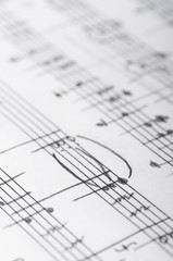 Handwritten musical notes, shallow DOF