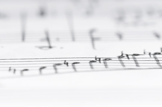 Handwritten musical notes, shallow DOF