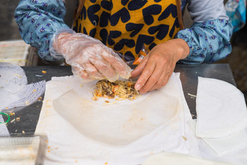 Making Vietnamese traditional spring rolls by hands