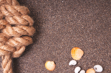 Marine rope with a knot on the sand