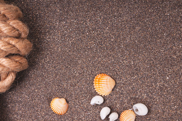 Marine rope with a knot on the sand