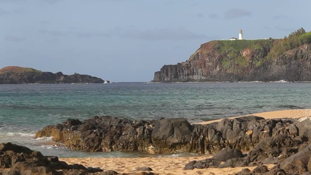 Kilauea Lighthouse and Mokuaeae Island as seen from Secret Beach (Kauapea Beach) on Kauai's northern shore.