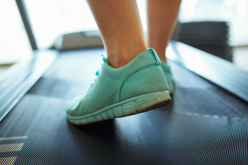 Foot of woman running on treadmill