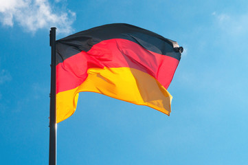 German flag on a background of the sky