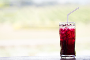 Grape juice on the table with blur background.