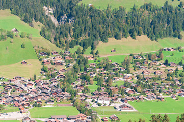 Fototapeta na wymiar A small village in a mountain valley in the Swiss Alps