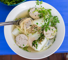 Egg soup cake, a thick Vietnamese noodle that can be made from tapioca flour or a mixture of rice and tapioca flour, covering eggs inside