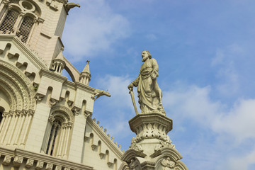 Fototapeta na wymiar Statue in front of Asian Christian Church