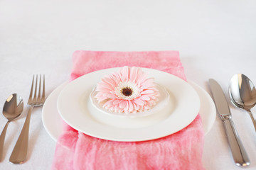 Valentine's Day pink decorated table setting for romantic dinner