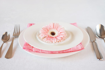 Valentine's Day pink decorated table setting for romantic dinner