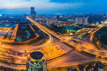Fototapeta na wymiar Aerial skyline view of Hanoi cityscape at twilight. Thang Long freeway and Pham Hung street