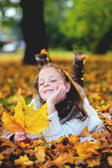 Young girl enjoy in autumn park