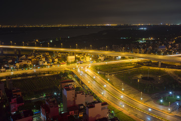 Fototapeta na wymiar Aerial view of skyline city at twilight. Hanoi cityscape at Nhat Tan bridge