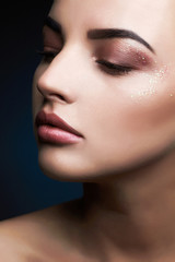 Fototapeta premium Beauty Makeup with glitter eye shadows.Beautiful Woman Makeup. female face