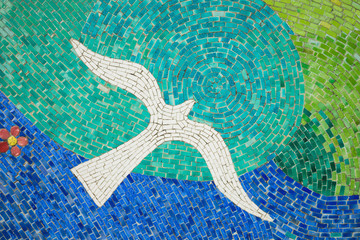 Fototapeta na wymiar Porcelain pieces mosaic background. Bird shape