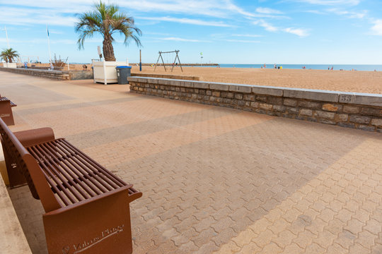 Valras Plage, beach promenade with inscribed public seating in southern France