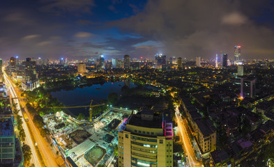 Fototapeta na wymiar Aerial view of urban skyline at twilight. Hanoi cityscape. Thanh Cong lake and Lang Ha street